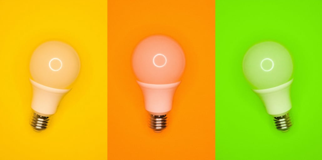 Light bulbs on colorful background